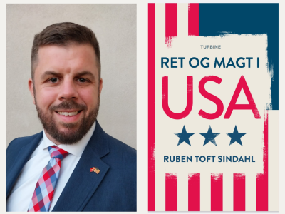 Mand i jakkesæt og bogforside