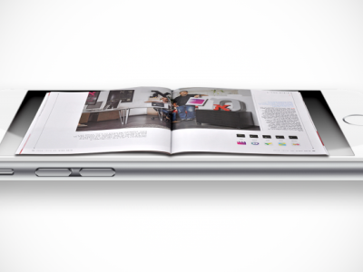 Telefon med artikel ovenpå skærmen